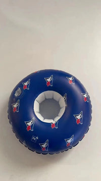 Blue inflatable ring with white center and red and white logo on a light gray background