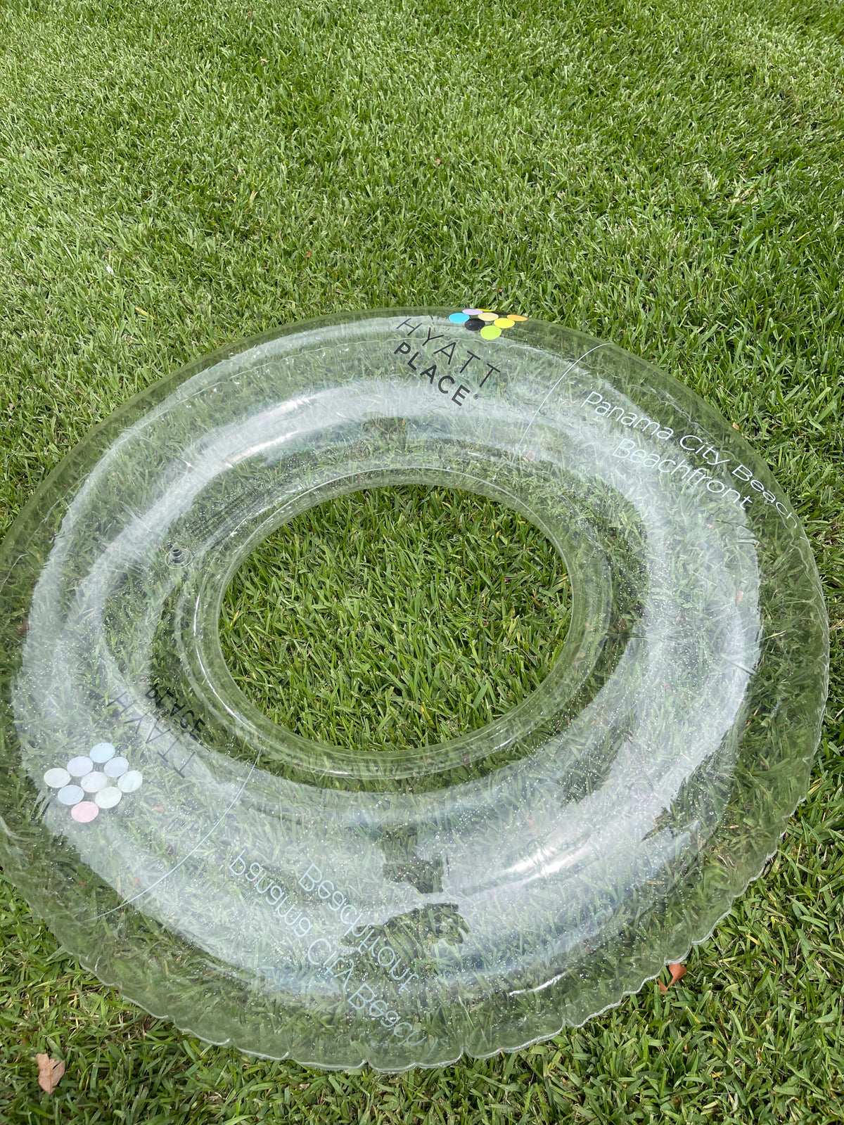 Clear inflatable ring on grass with text '1st Place'