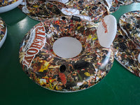 Decorative Lazy Susan with colorful design on a green surface