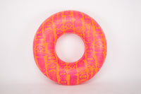 Pink and orange inflatable ring on a white background