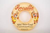 Round promotional pool float for Kerrville Triathlon Fest with cartoon deer characters on a white background