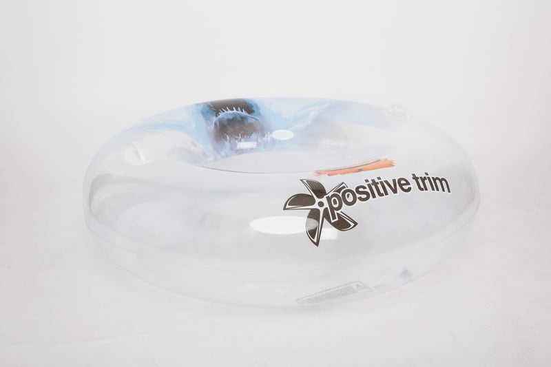 White object with 'positive trim' text and logo on a light gray background
