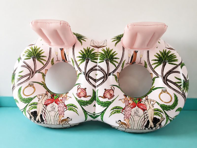ring tube with tropical design on a teal surface